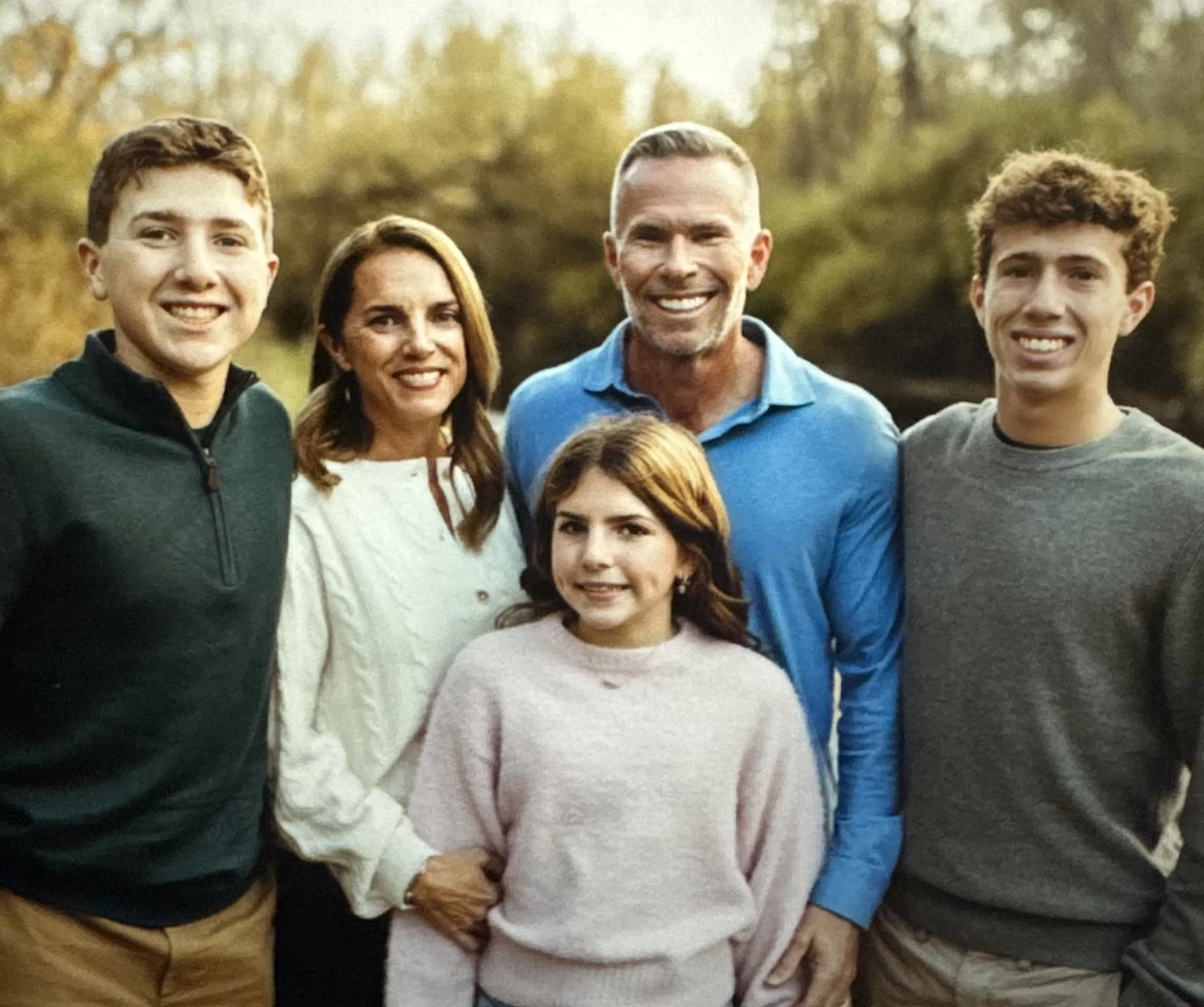 Dr. Brad Stutler with his wife, Susie, and their three children outdoors